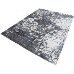 Modrý prskaný koberec s abstraktným motívom - moderný ligotavý koberec